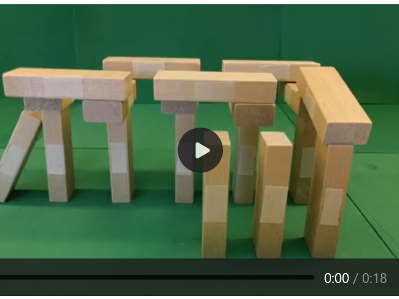 Rectangular blocks are standing vertically and stacked on top of each other. 